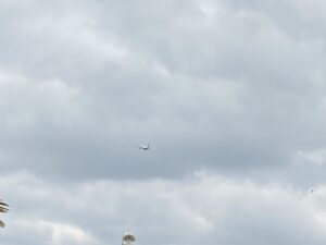 A passenger aircraft beneath low grey cloud over Sheldon
